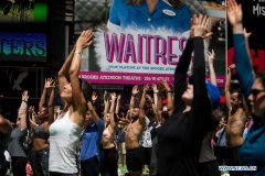 People participate in free yoga class to celebrate solstice in New York