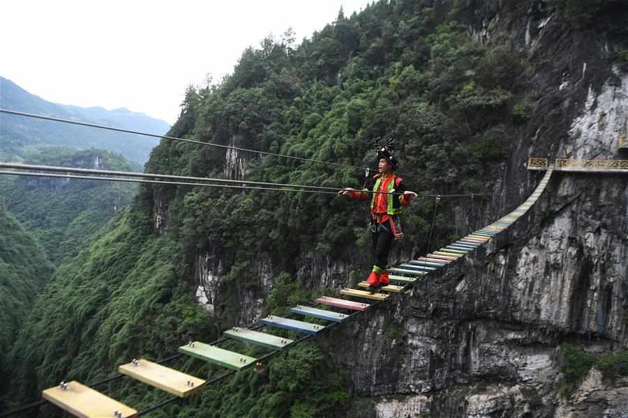 Ayi River scenic spot in SW China integrates natural beauty with folk culture to develop tourism industries