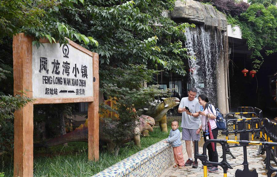 Tourists enjoy their leisure time in Fenglongwan, Yunnan