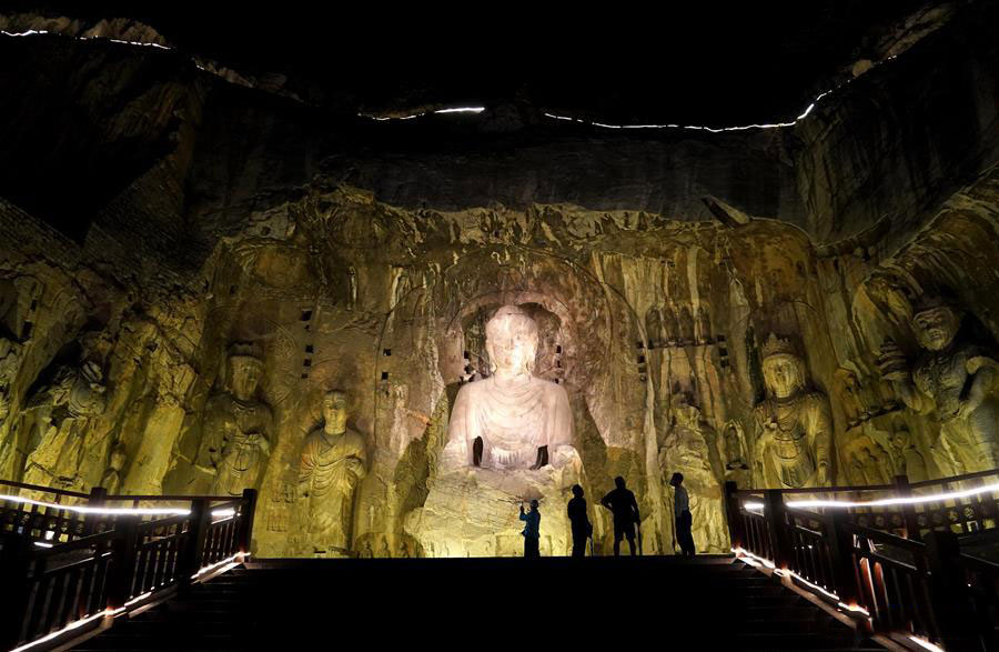Tourists take part in night tour at Longmen Grottoes scenic area