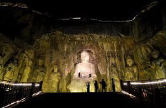 Tourists take part in night tour at Longmen Grottoes scenic area