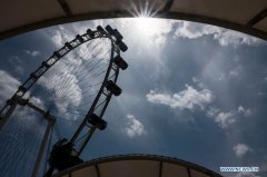 Sun halo appears in sky above the Singapore Flyer