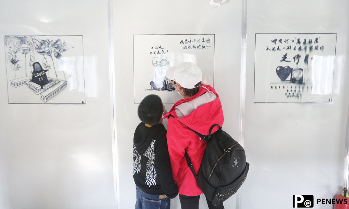 One year after outbreak, medics from around the country return to Wuhan to enjoy cherry blossoms