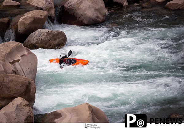 Chinese whitewater kayakers have run Class-V Laojun Rapid, paying tribute to Jinsha River