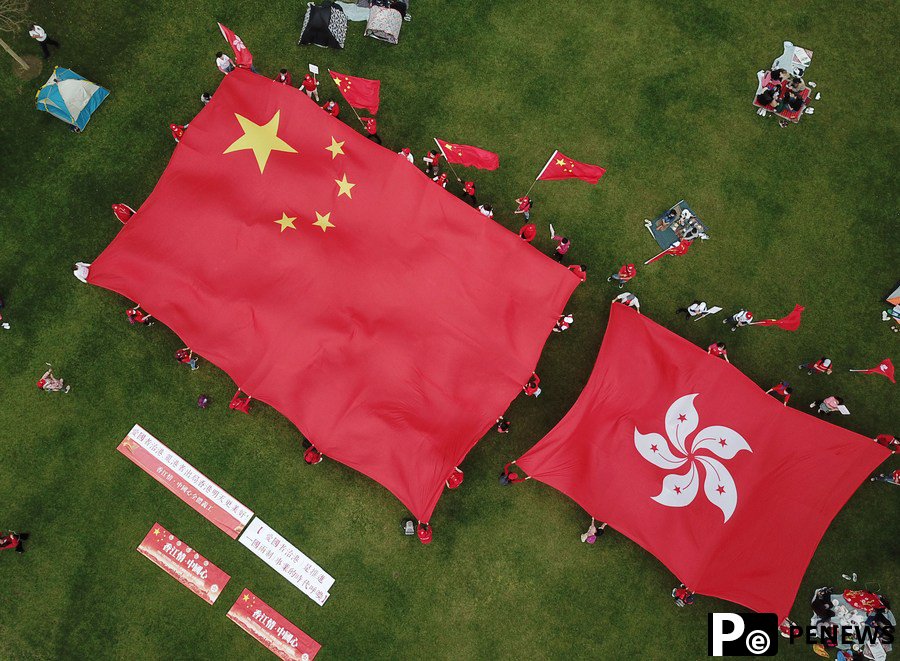 China amends Basic Law annexes to improve Hong Kong