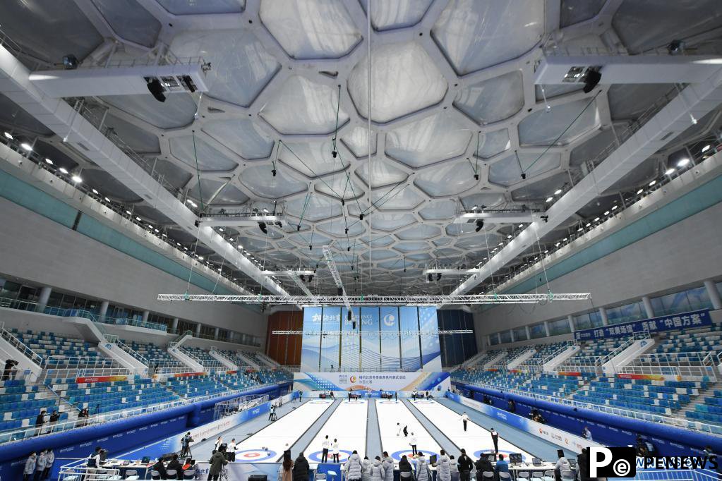 Athletes compete during curling test program at National Aquatics Center in Beijing