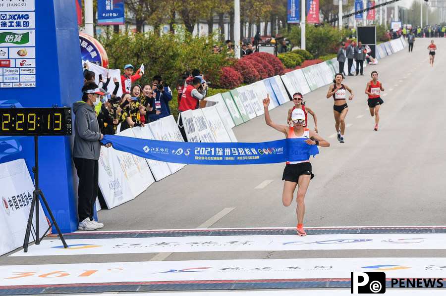 Zhang, Peng clinch Olympic slots with victories at Xuzhou Marathon