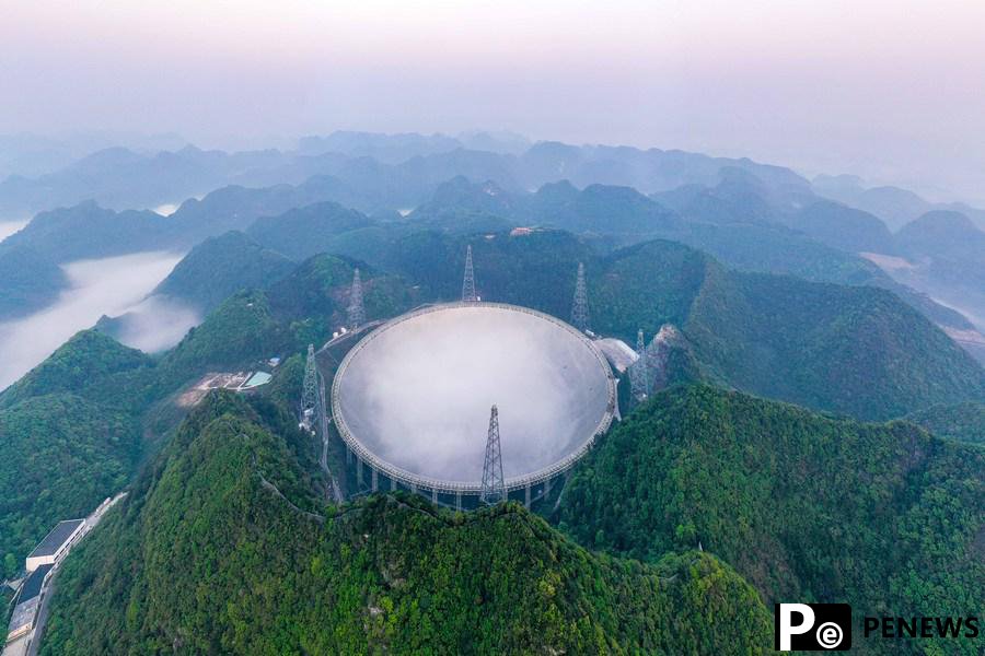 Xi