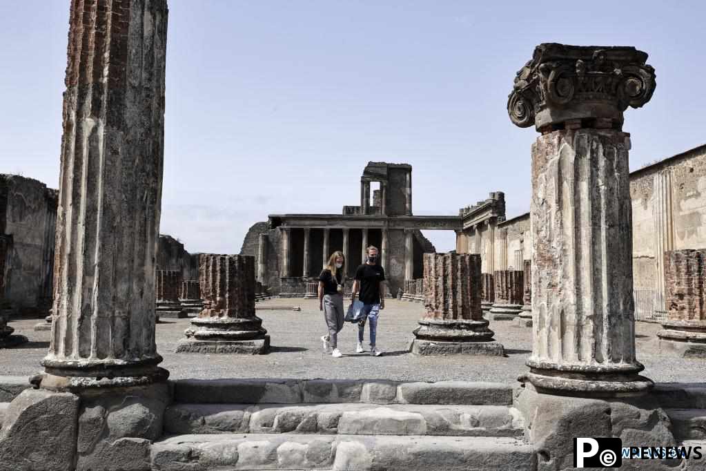 People visit Archaeological Park of Pompeii in Italy