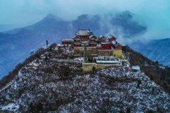 Yuntai Mountain in Central China's Henan: Shimmering silver snows adorn scenes of red autumnal leaves