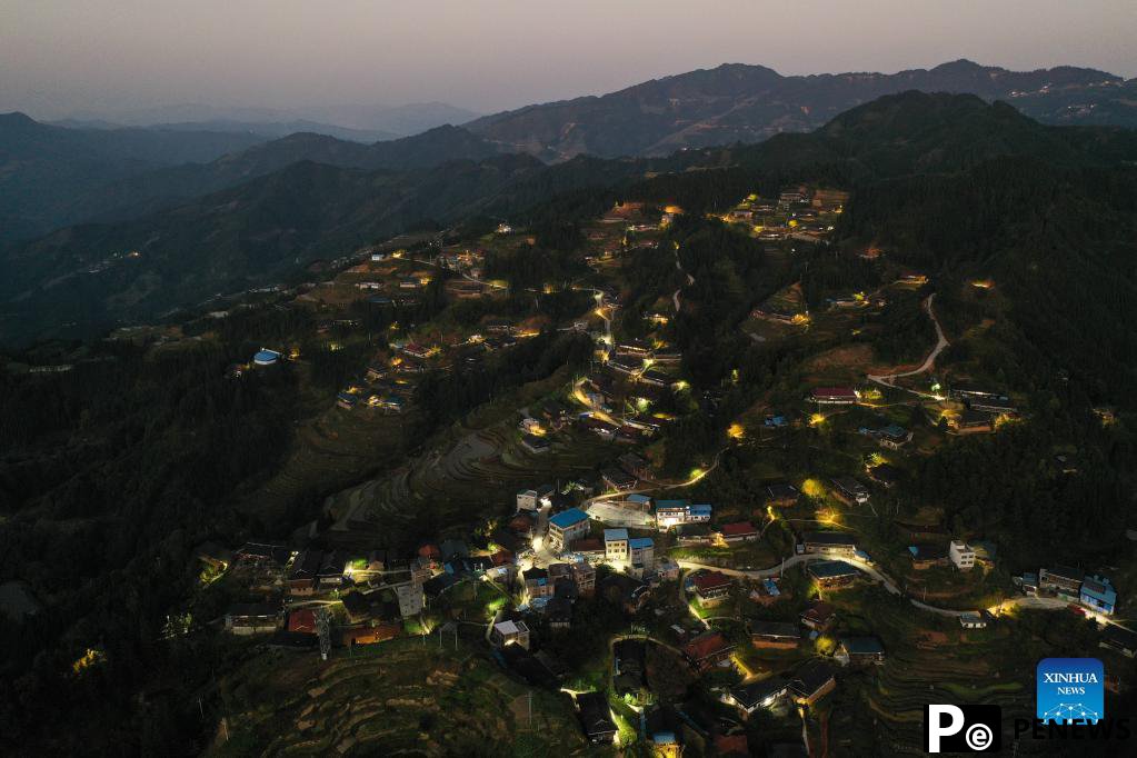 Solar powered street lamps illuminate night sky in south China