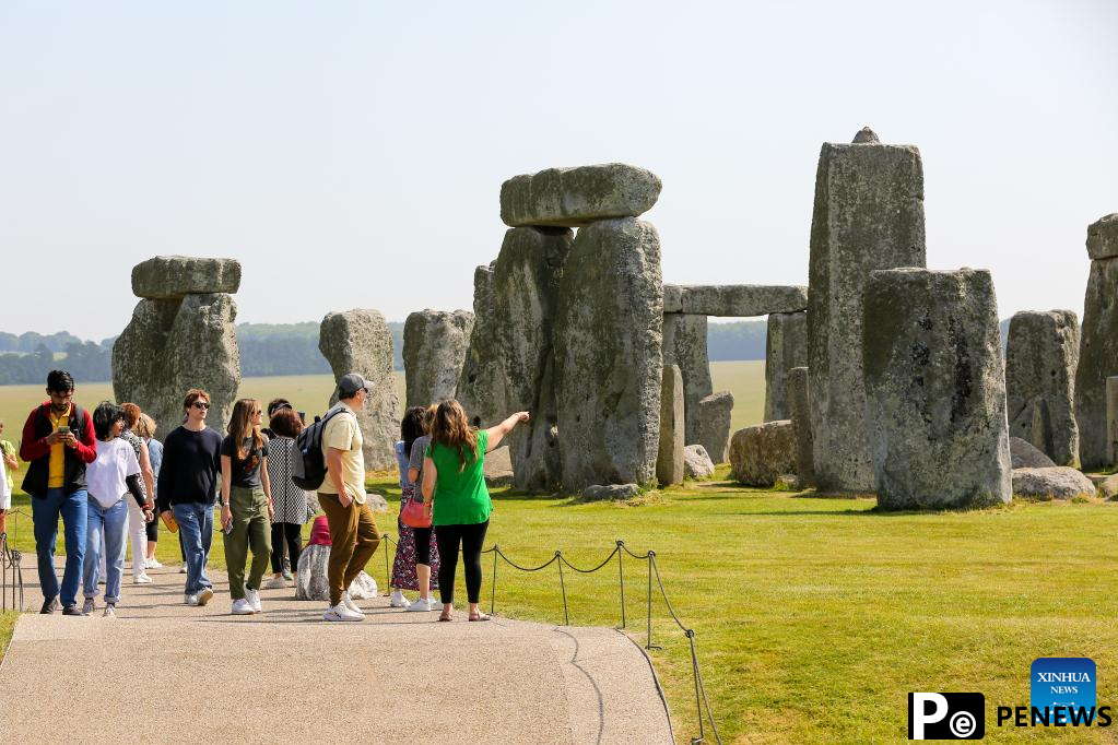 People visit Stonehenge in Amesbury, Britain