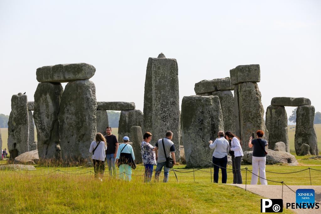 People visit Stonehenge in Amesbury, Britain