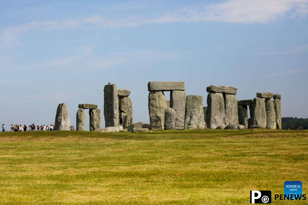People visit Stonehenge in Amesbury, Britain