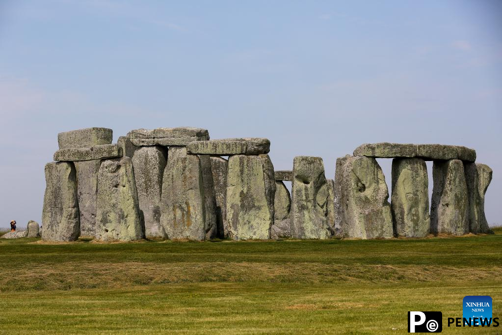 People visit Stonehenge in Amesbury, Britain