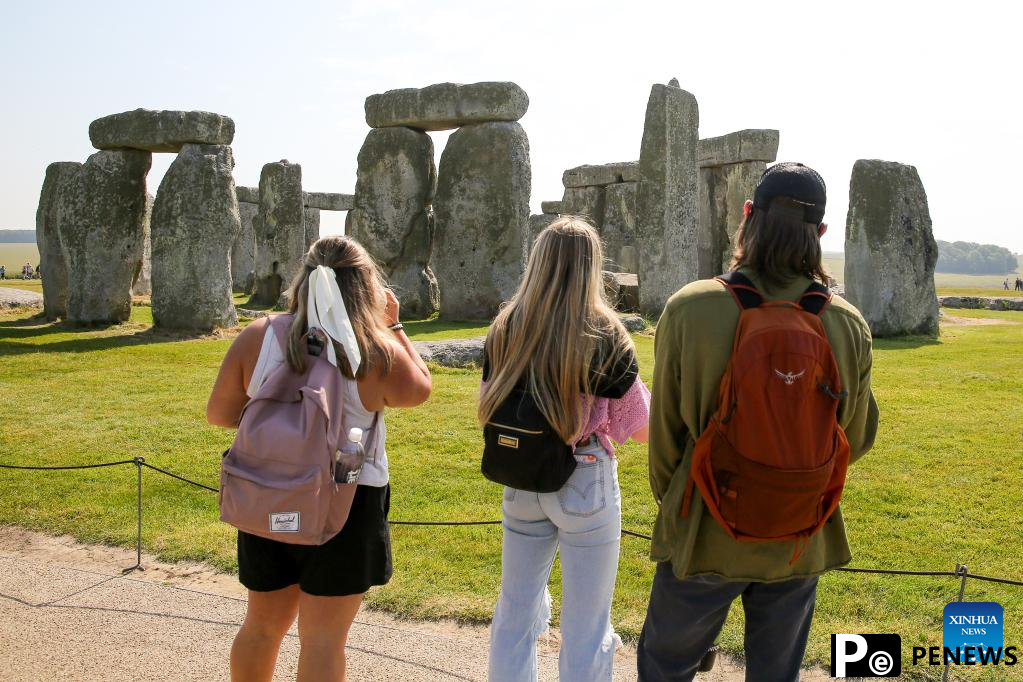 People visit Stonehenge in Amesbury, Britain