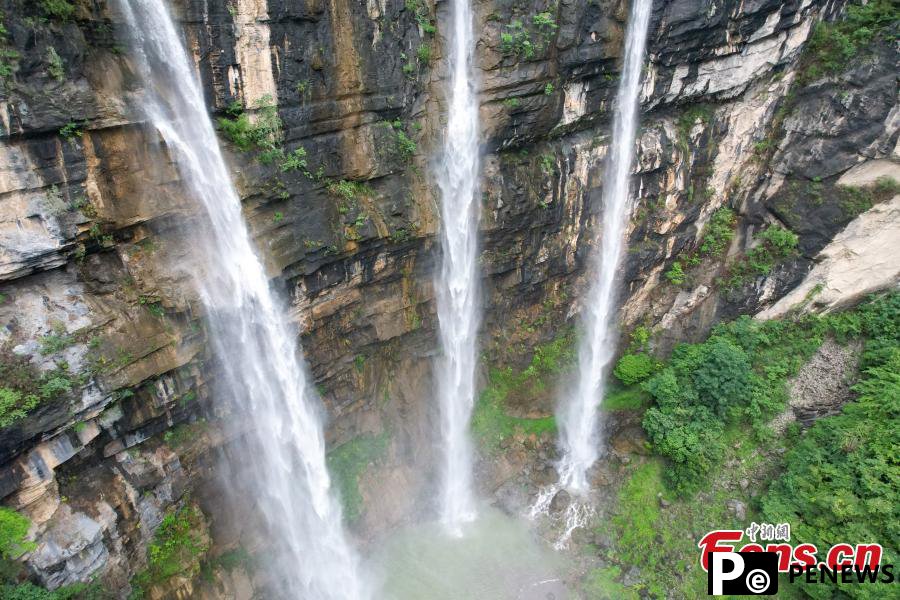 Triple waterfalls cascade down mountain in Guizhou