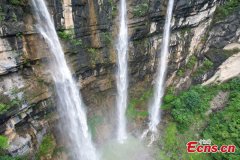 Triple waterfalls cascade down mountain in Guizhou