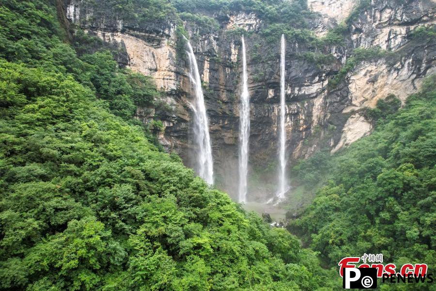 Triple waterfalls cascade down mountain in Guizhou