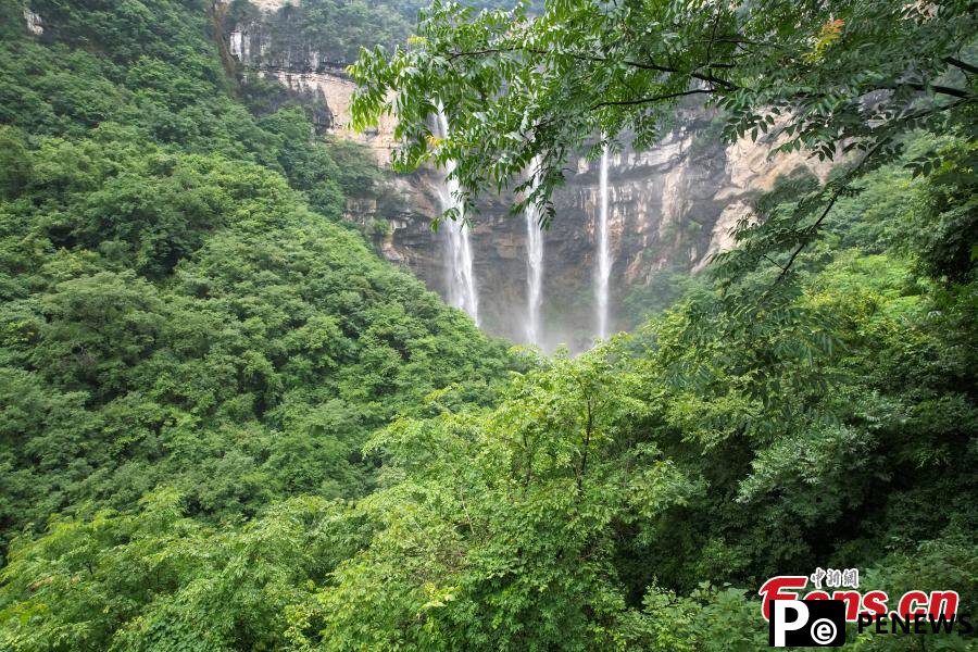 Triple waterfalls cascade down mountain in Guizhou