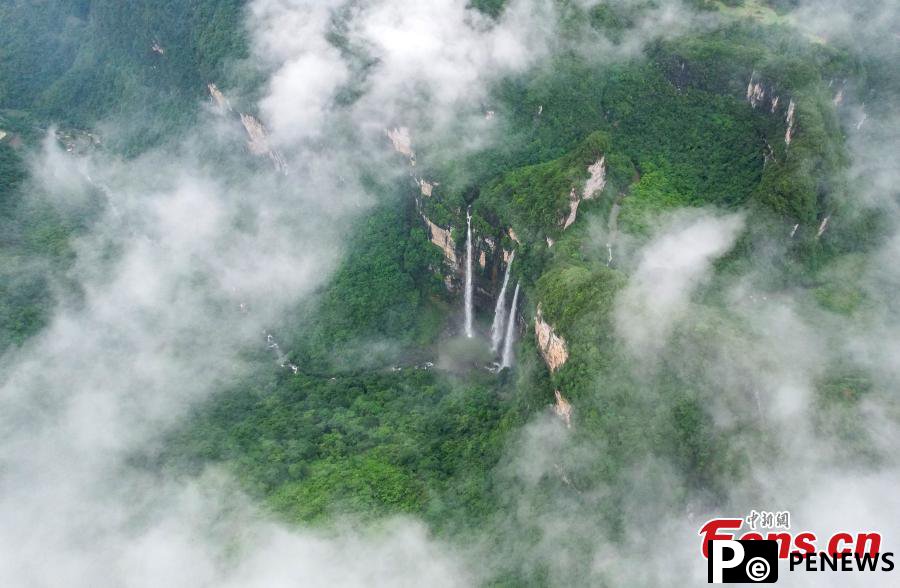 Triple waterfalls cascade down mountain in Guizhou