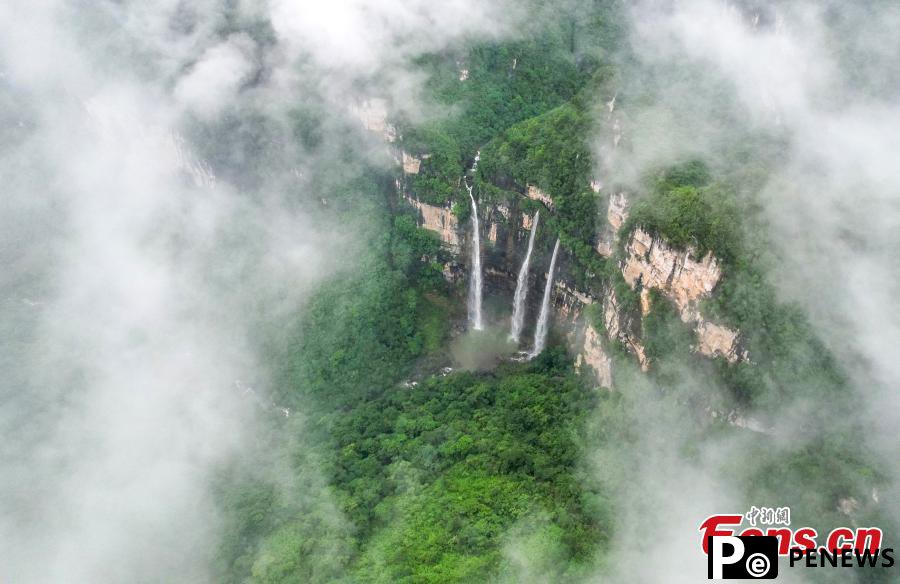 Triple waterfalls cascade down mountain in Guizhou