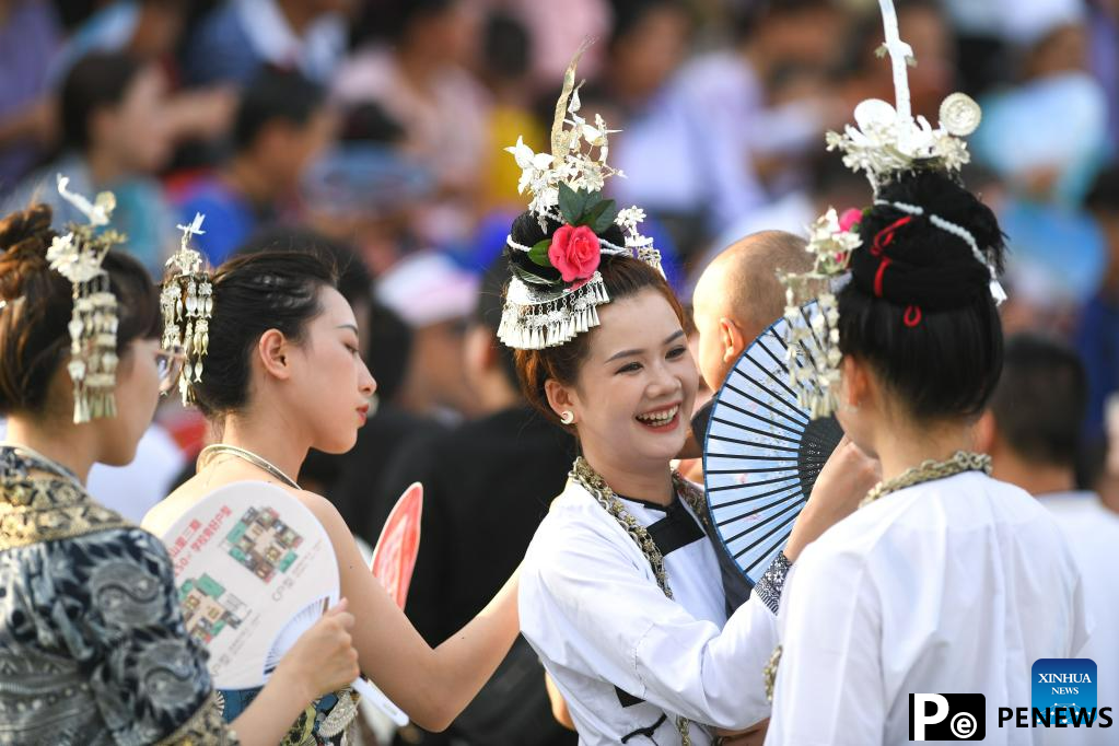 Villagers in ethnic dress give performance for "Village Super League" football match in Guizhou