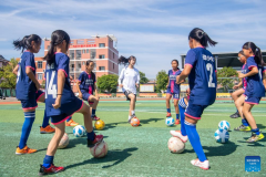 The rural girls chasing goals on football pitches