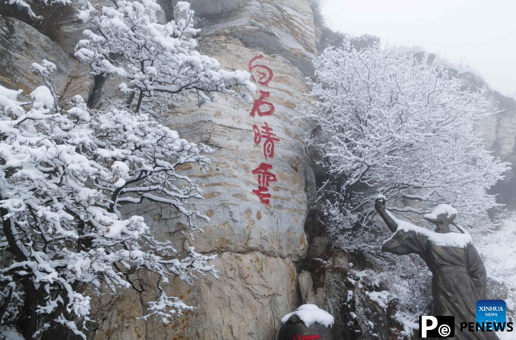 Baishi Mountain covered in snow in Laiyuan County, N China