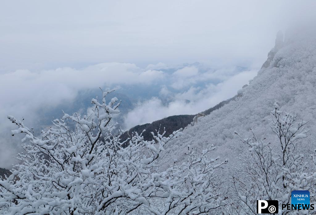 Baishi Mountain covered in snow in Laiyuan County, N China