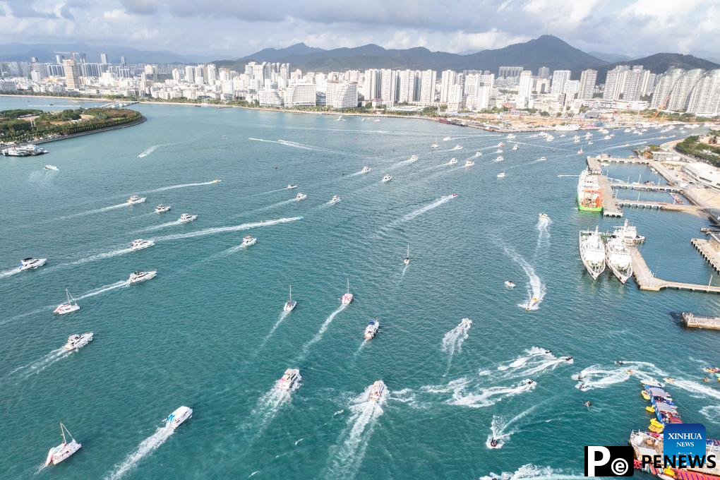 Yachts ride waves in Sanya, China