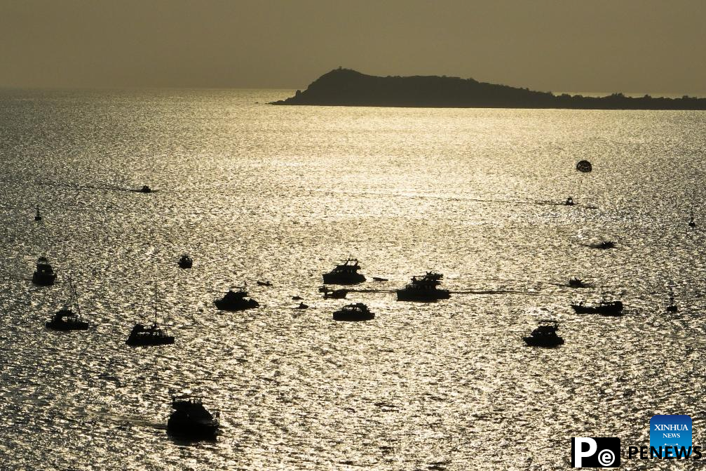 Yachts ride waves in Sanya, China