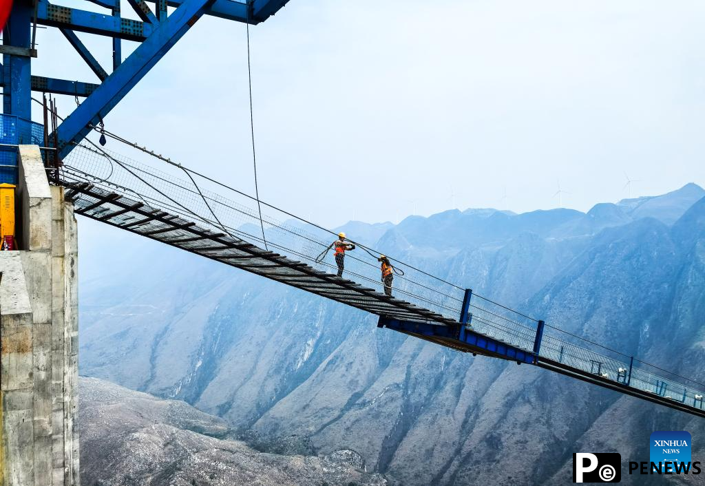Huajiang grand canyon bridge under construction in SW China