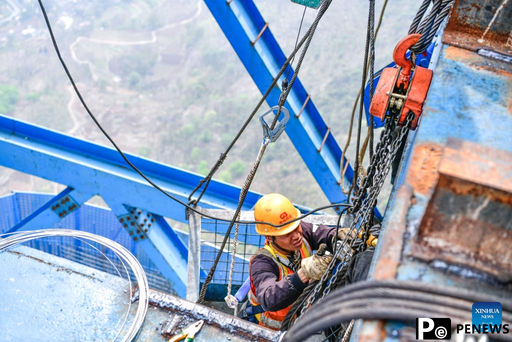 Huajiang grand canyon bridge under construction in SW China