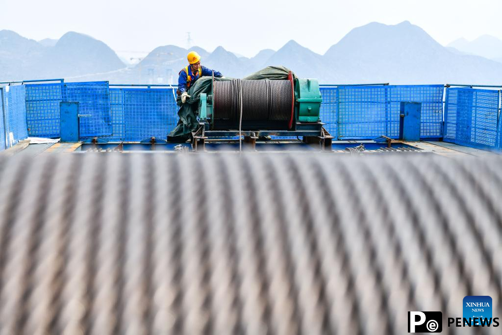 Huajiang grand canyon bridge under construction in SW China