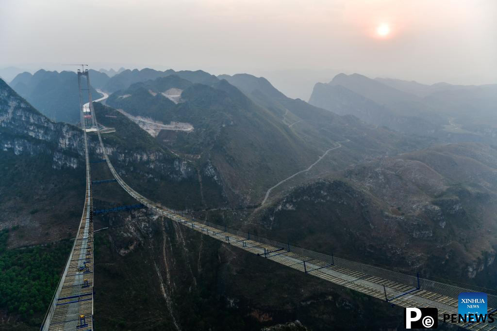 Huajiang grand canyon bridge under construction in SW China