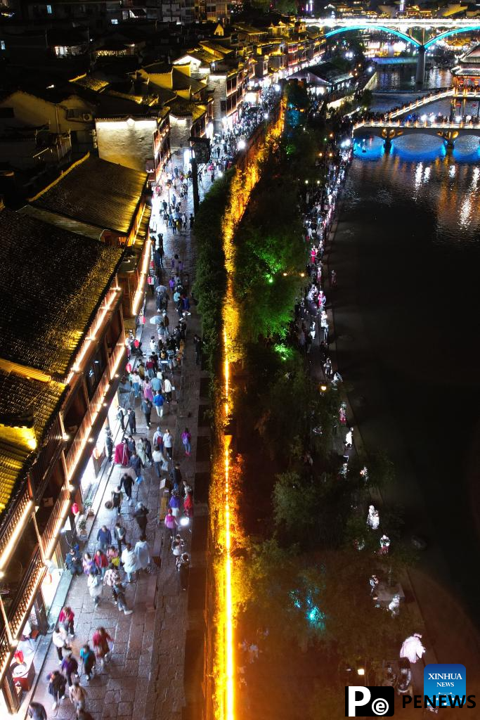 Tourists enjoy themselves during May Day holiday across China