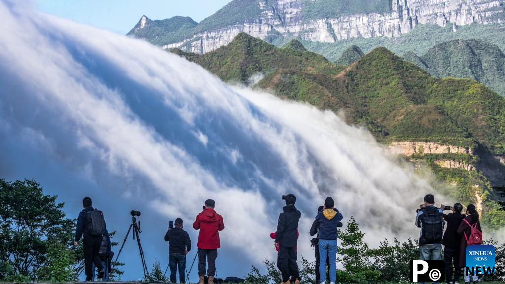In pics: clouds streaming down Jinfo Mountain in China