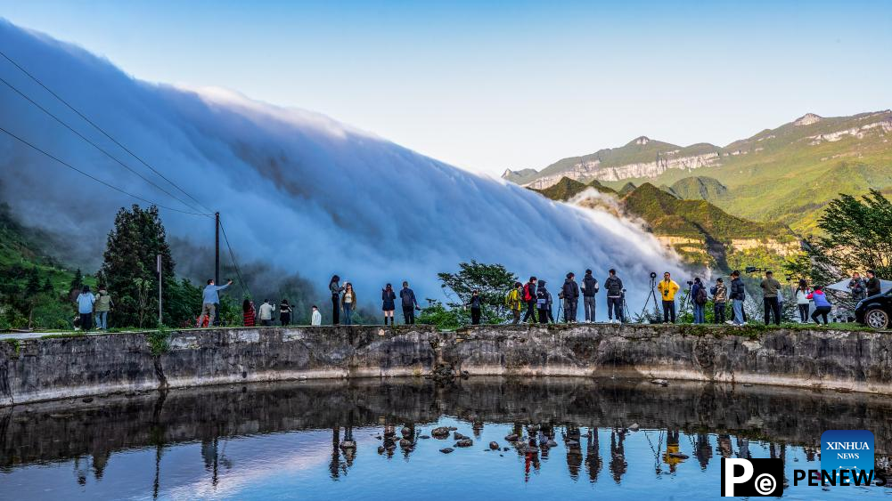 In pics: clouds streaming down Jinfo Mountain in China