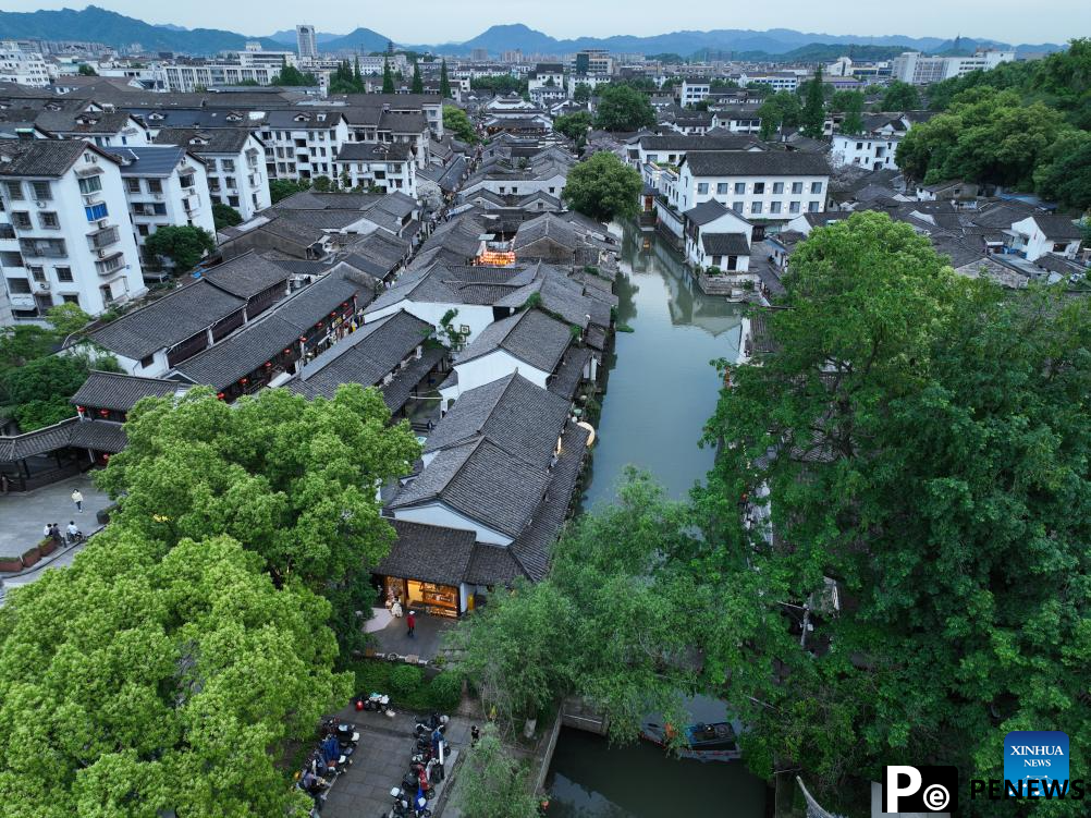 People enjoy leisure time in Cangqiao Straight Street in Shaoxing, China
