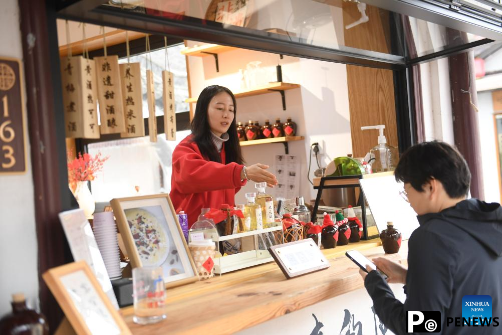 People enjoy leisure time in Cangqiao Straight Street in Shaoxing, China