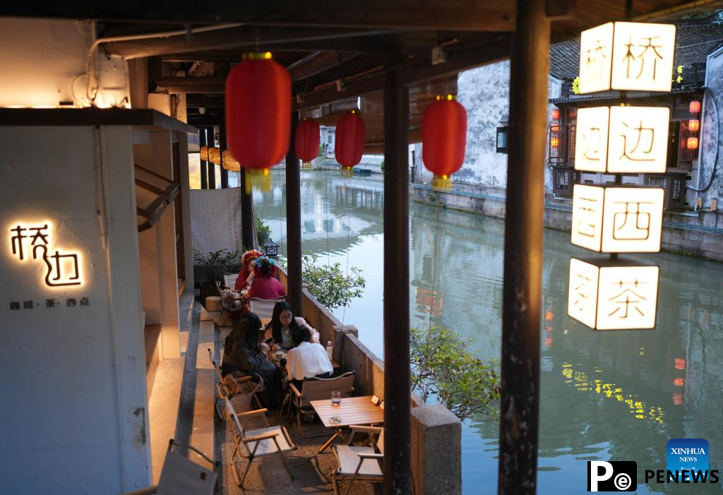 People enjoy leisure time in Cangqiao Straight Street in Shaoxing, China