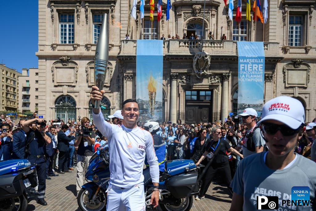 Olympic torch relay completes first day in France, Drogba lights cauldron