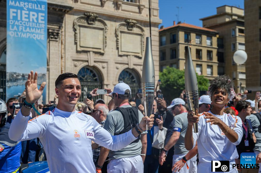 Olympic torch relay completes first day in France, Drogba lights cauldron