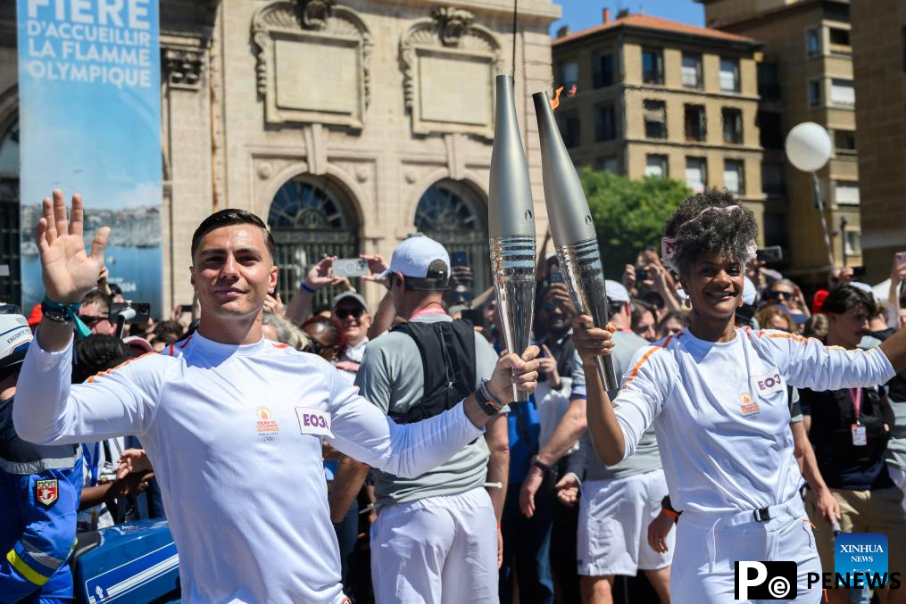 Olympic torch relay completes first day in France, Drogba lights cauldron