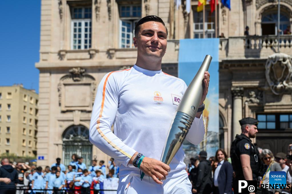Olympic torch relay completes first day in France, Drogba lights cauldron