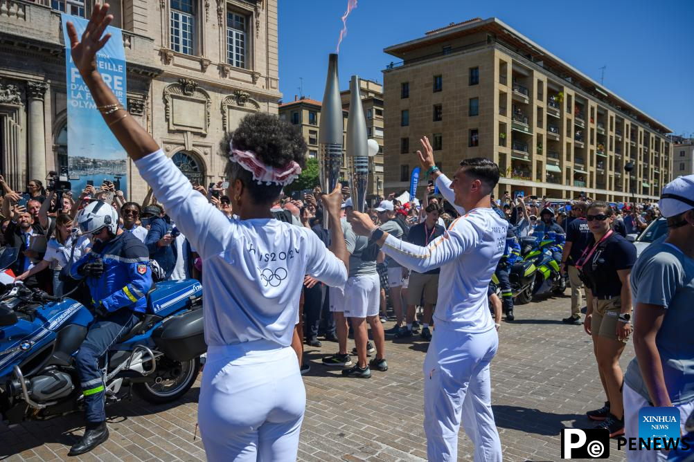 Olympic torch relay completes first day in France, Drogba lights cauldron
