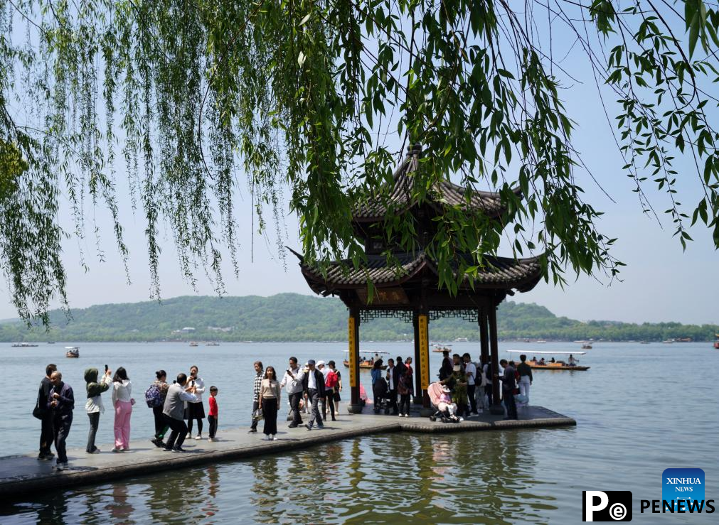 Tourists visit West Lake in Hangzhou, E China