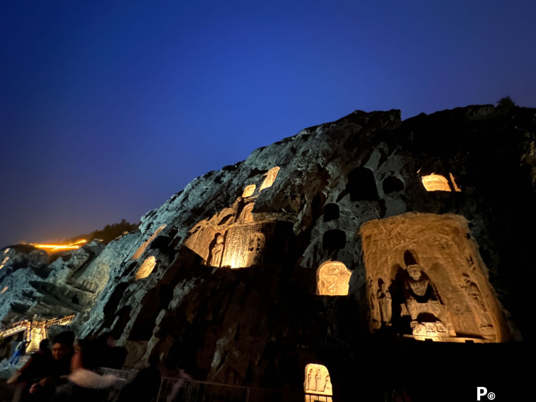 Embark on a mesmerizing night tour of Longmen Grottoes, C China