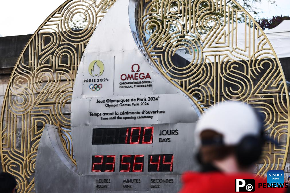 Countdown clock for Paris 2024 Olympic Games seen in front of Eiffel Tower